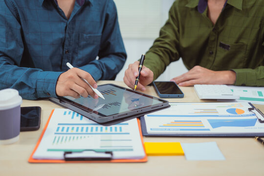 Close-up of a businessman in a meeting at the office discussing topics related to digital marketing management, financial analysis, business writing, teaching, and venture capital investments.
