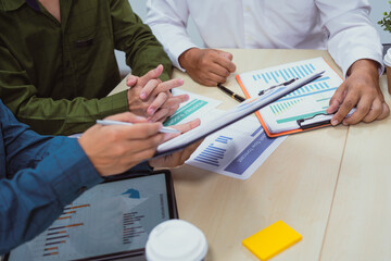 Close-up of a businessman in a meeting at the office discussing topics related to digital marketing...