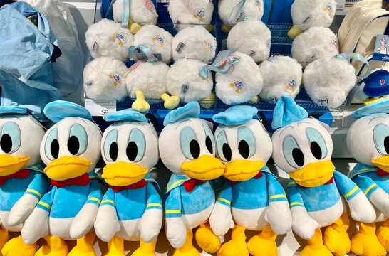 Jakarta, Indonesia - September 11th, 2024 - Donald duck disney cartoon character plush doll toys for sale in Ohsome retail store display table background.