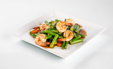 Delicious stir-fried shrimp with green beans and carrots served on a white plate. A healthy and vibrant dish perfect for any meal.