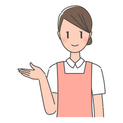 ピンクのエプロン姿、笑顔で案内する歯科助手・歯科衛生士の女性スタッフ