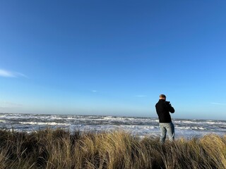 person walking on the beach