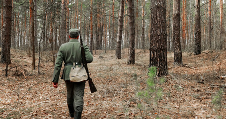 World War II German Wehrmacht Infantry Soldiers Of World War II Marching Running Along Forest In Spring Autumn
