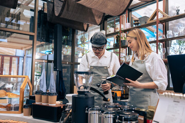 Asian attractive male barista or waiter working in coffeehouse shop