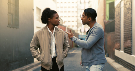 Angry, argument and men fighting in city with threat for aggressive disagreement, physical harm and...