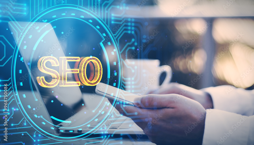 Poster close up of businessman hands using cellphone at desk with laptop, coffee cup and glowing digital da