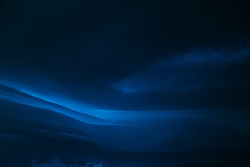 Deep blue Cloudy Sky With Dark Storm Clouds During Rain. Natural Background With Rainclouds. natural weather background dark blue color backdrop thunderstorm stormy sky
