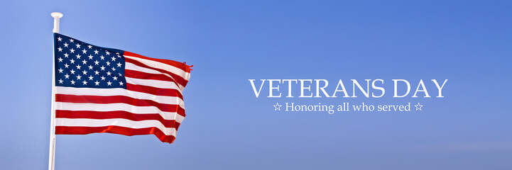 Obraz premium American flag on panoramic sky background with text for Veterans Day web banner
