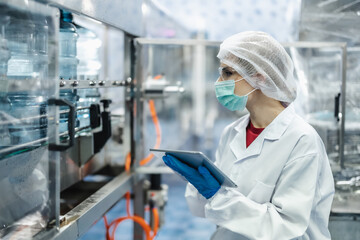 Worker people working in Drinking water factory, Hygiene uniform cleanliness workplace with clean...