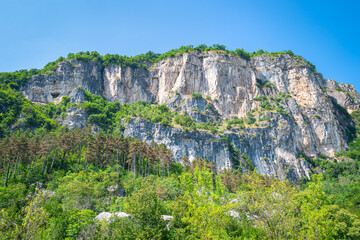 Huge rock formation used for mountain climbing and ¨via ferrata¨ near the village of Mori, province of Trento, Italy.