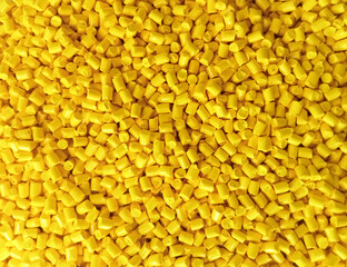 Yellow polymer granules, yellow masterbatch granules, cold cutting material type, isolated on white...