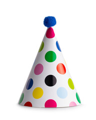 Classic white party hat with multi coloured polka dots and blue pompom standing isolated  on white background