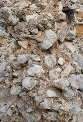Detailed view of the ruined castle wall at Tekkadin Archaeological Site, an example of wall...
