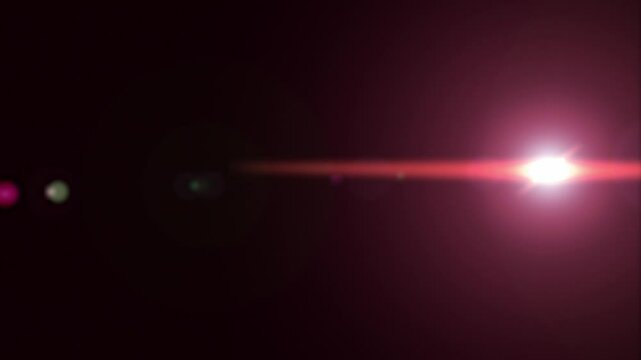 a red pink flash of light, a glare on the lens. background motion animation.