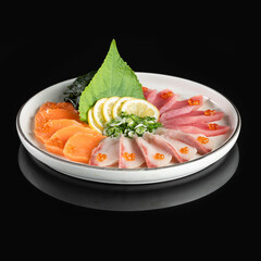 Fresh sashimi platter featuring salmon, tuna, and white fish with lemon slices and garnish, served on a white plate with a black background.