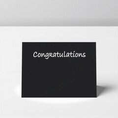 A sleek black background card with "Congratulations" written in simple white sans-serif font, offering a minimalistic and professional look