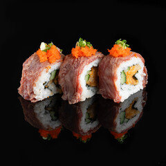 Gourmet sushi rolls with beef, vegetables, and roe. Black background with a reflection. Japanese cuisine delicacy for festive environments.