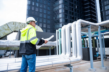 The technician carefully inspecting a section of pipeline during a construction project, emphasizing safety and precision in infrastructure development.