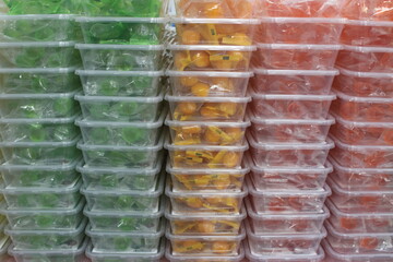 Candies in stacked plastic containers