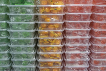 Candies in stacked plastic boxes