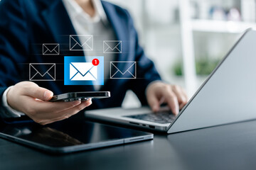 Businesswomen using smartphones check New email notifications and business digital online marketing. Inbox receiving electronic message alert. icon envelope virtual screen, communication technology.