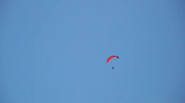 Paraglider Sky Blue - Single paraglider flying in a blue sky.