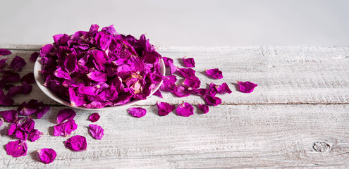 Dry rose petals in a bowl