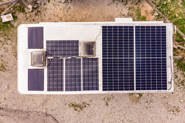 Rv camper with solar panels on roof. Aerial view