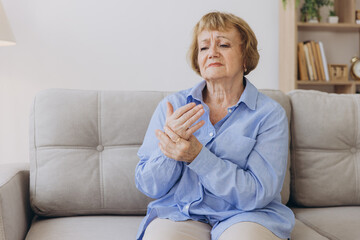 Elderly woman suffering from pain in hand, arthritis old person and senior woman female suffering...