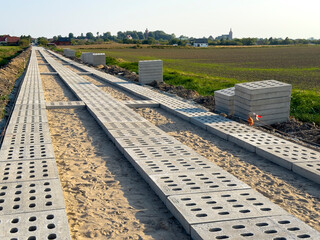 Process of making a new road with concrete slabs as a surface.