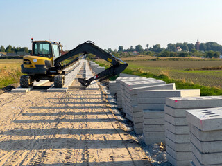 Process of making a new road with concrete slabs as a surface.