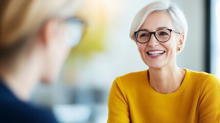 Senior woman meeting with a young startup founder, mentorship and collaboration