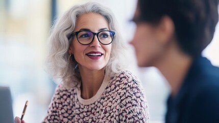 Senior woman meeting with a young startup founder, mentorship and collaboration