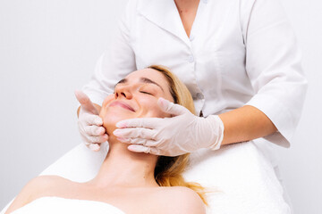 Luxurious spa setting: facial massage in a modern cosmetic clinic. Premium care for relaxation and rejuvenation. Ideal for promoting spa treatments and cosmetic services.