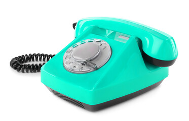 Old turquoise color telephone with rotary dial isolated on white