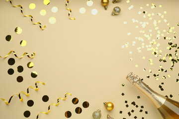 Flat lay composition with confetti and bottle of sparkling wine on beige background, space for...
