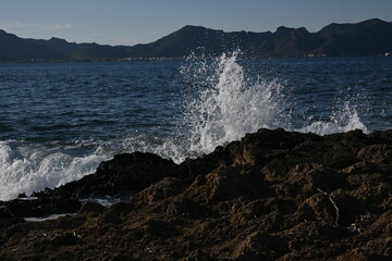 waves breaking on the rocks