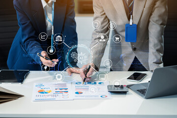 Businessmen team or financial data analysts working with tablets and laptop computers and data...