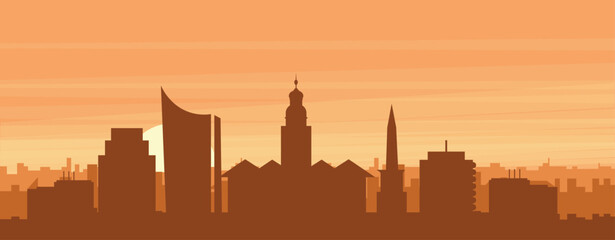 Fototapeta premium Brown panoramic poster of the city skyline with misty background buildings, sunrise, clouds and mountains of LEIPZIG, GERMANY