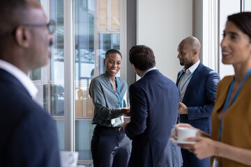African American businesswoman shaking hands at a corporate networking event