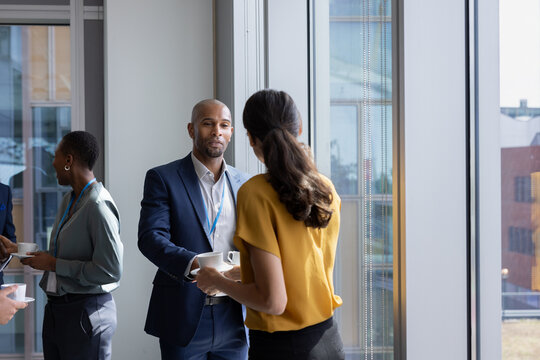 African American businessman shaking hands at a corporate networking event