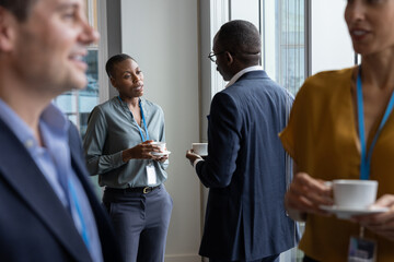 Businesswoman speaking with a colleague at a business conference