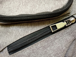 Backpack pockets closed zipper closeup view