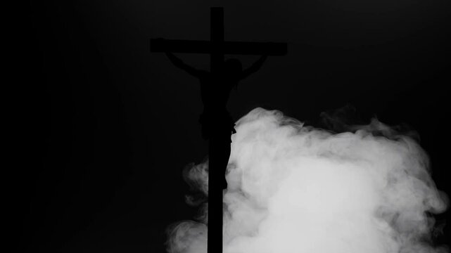 A Rising Fog Slowly Revealing Jesus Christ on a Cross