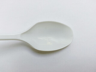 White Spoon closeup view isolated on white background