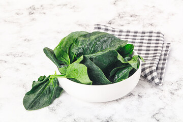 Ripe green spinach leaves heap