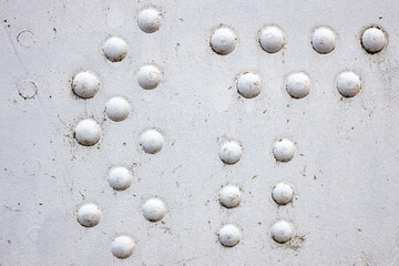 Plane - Constructional close up aluminum metal rivets of vintage airplane.