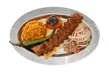 Top view Grilled Turkish Adana, Urfa Kebab with grilled tomatoes and pepper and onion and on plate. Adana durum.  ,isolated on white background