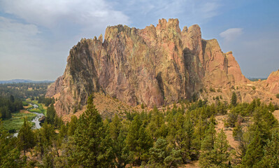 eroded  volcanic rock formations and dramatic cliffs on a sunny summer day  in the high desert of smith rock state park, near bend,  in central oregon