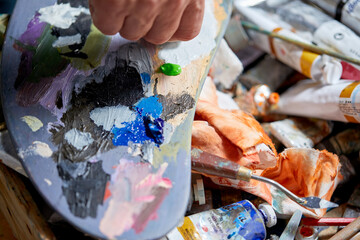 Oil paints palette and paint brushes